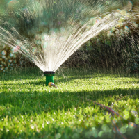Photo of running lawn sprinkler 
